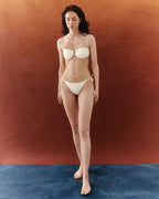 BAHÍA TOP BRONCEADOR MANTEQUILLA - BURMONT